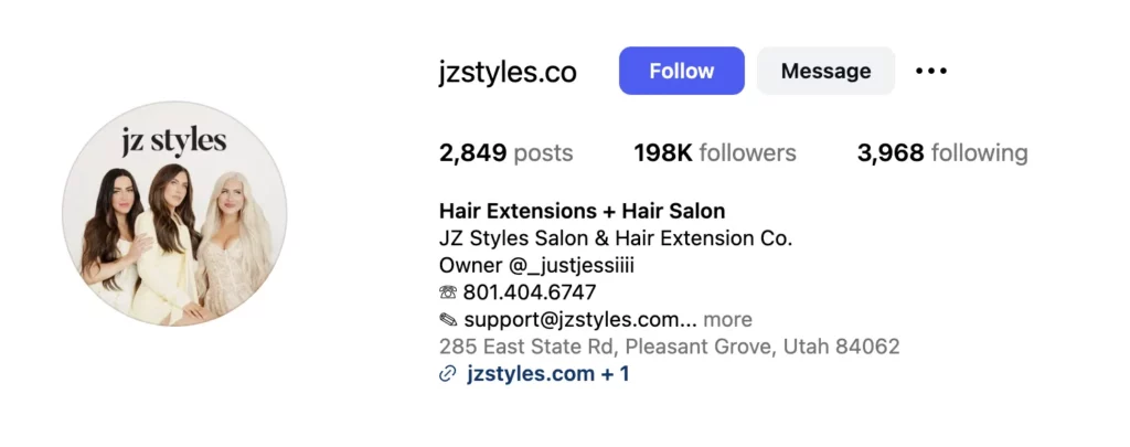 A screenshot of an Instagram bio with a profile picture that reads, "JZ Styles," showcasing three hair stylists within an ombre orange-pink circle. Text outlines the business details.