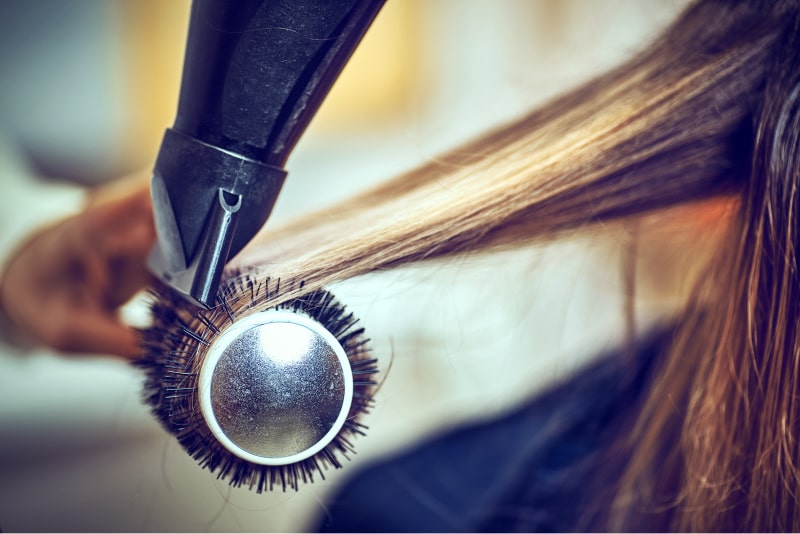 salon tools closeup of hair getting blowed dry