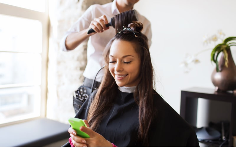 woman getting hair done in her own home with mobile salon