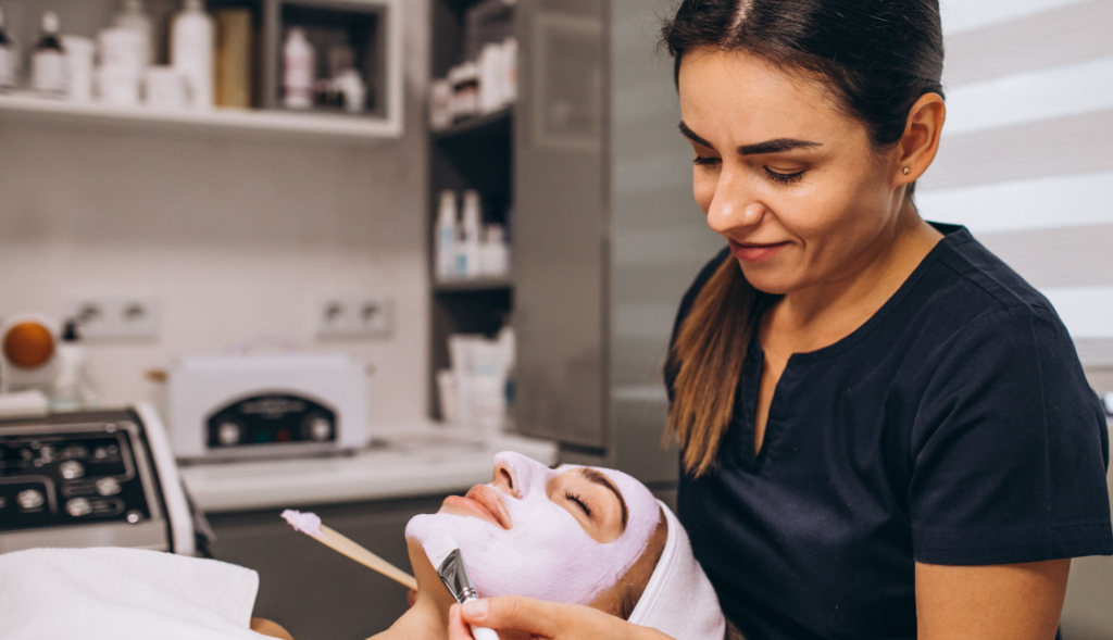 esthetician giving face treatment hero