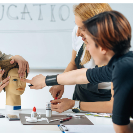 cosmetology students learning in classroom