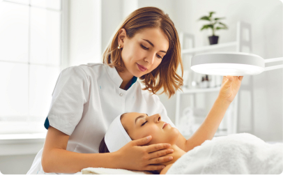 cosmetologist looking at client face