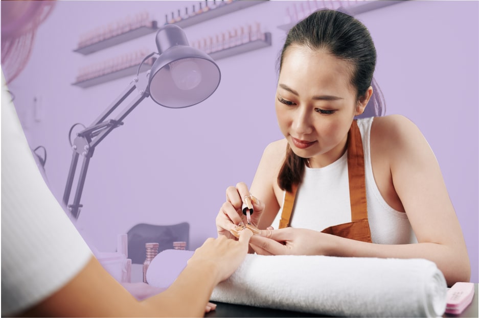 close up of woman painting nails