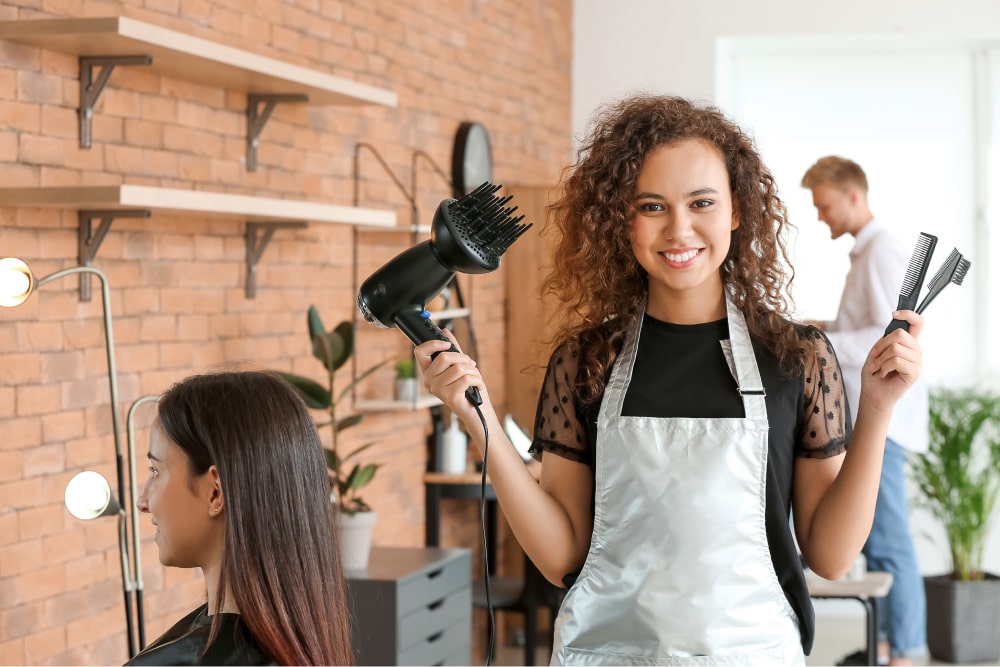 professional beauty worker in hair salon smiling