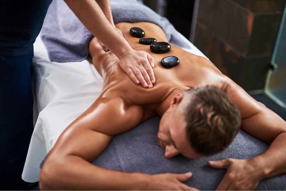 man getting stone massage