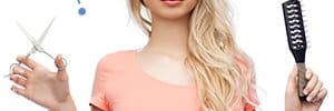 hairstylist holding scissors and brush