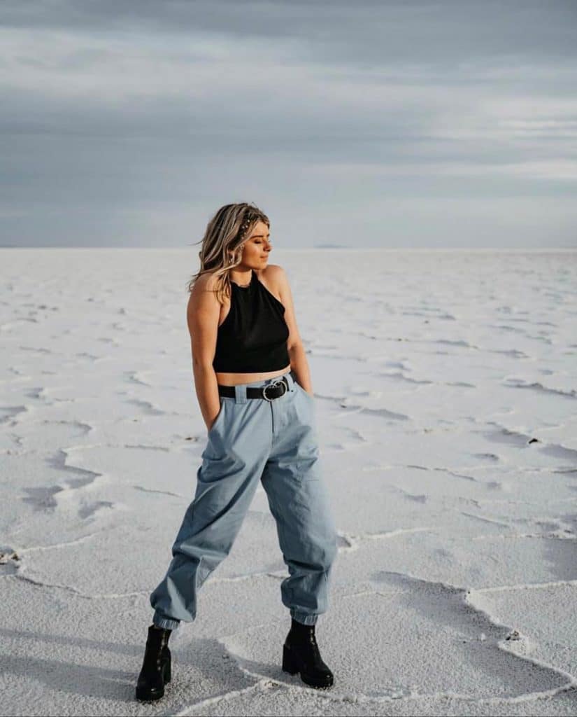 woman posing standing in the salt flats in utah