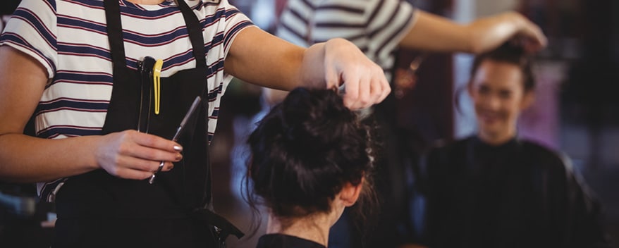 beautician styling clients hair