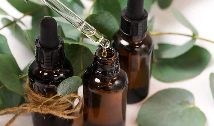 massage oils sitting around eucalyptus