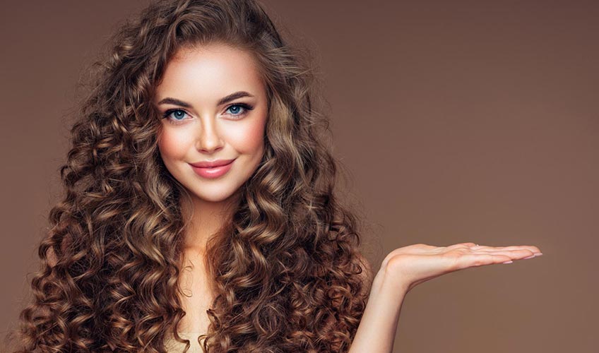 woman posing with voluminous curly hair