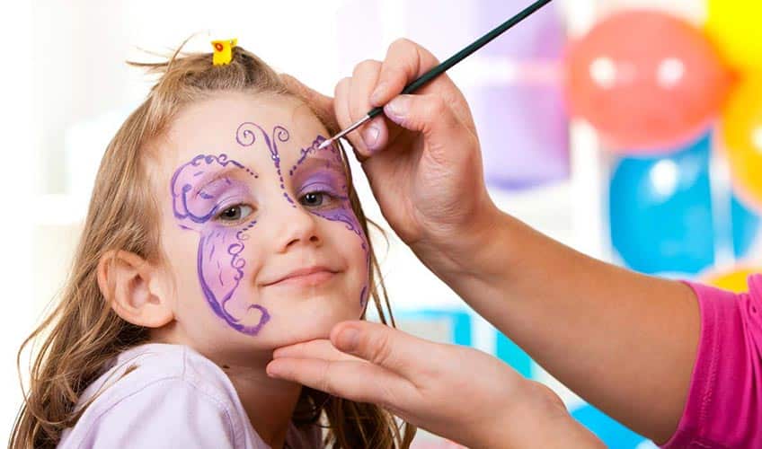 little girl getting her face painted