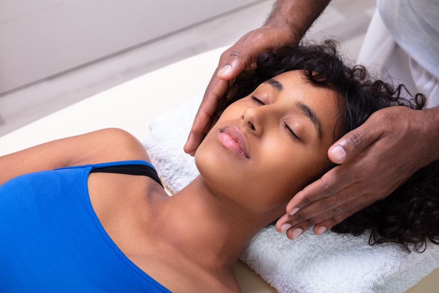 woman getting energy work treatment