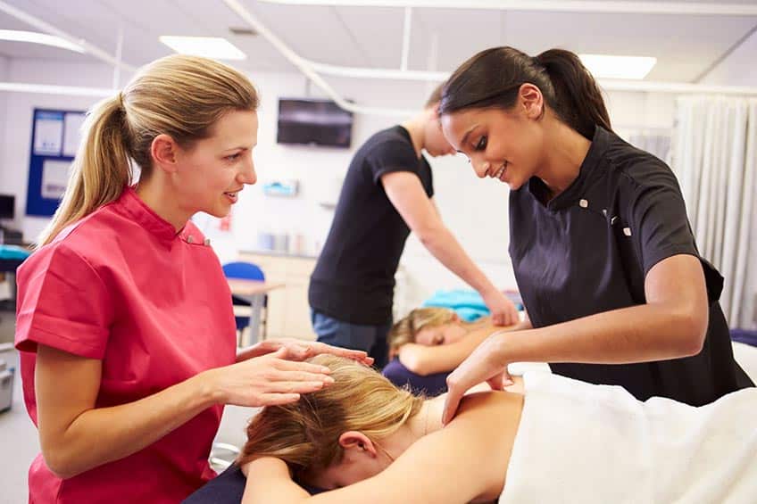 massage professional teaching massage therapy to students