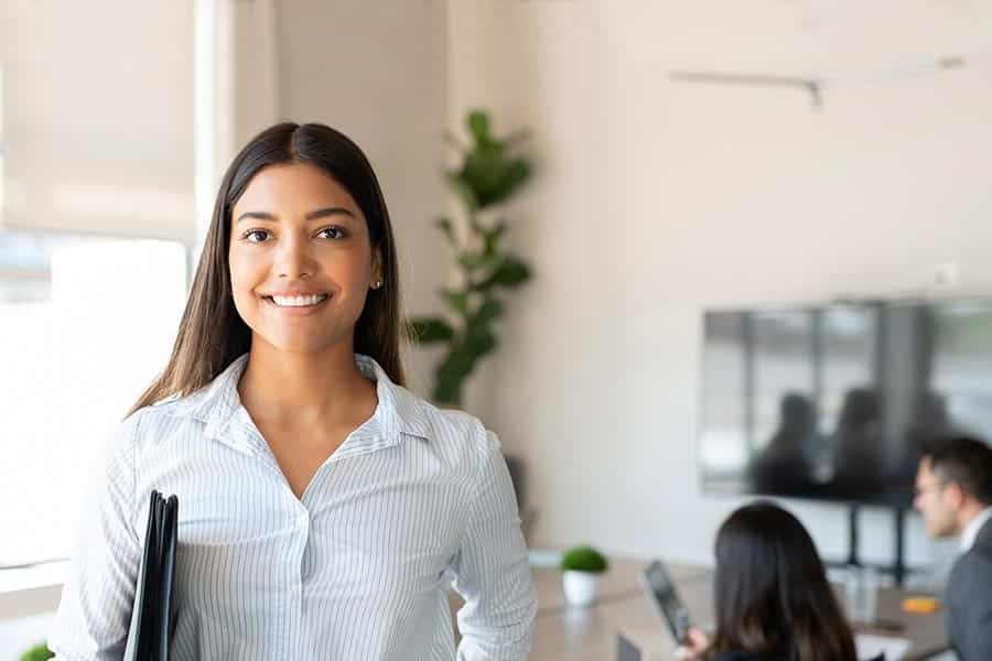 female business professional smiling for camera in conference room