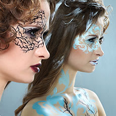 women with their face and body painted