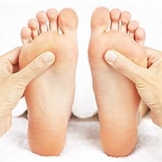 reflexology massage on feet