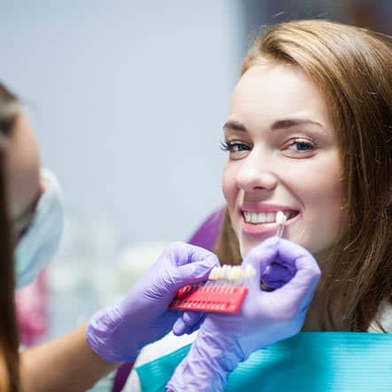 woman at teeth whitening treatment appointment