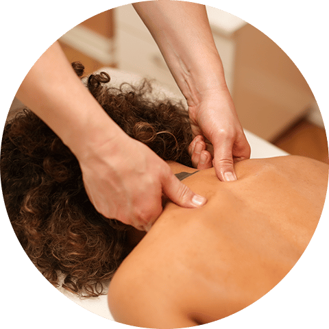 massage therapist giving a deep tissue massage to client