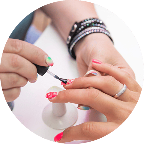 nail technician applying nail polish
