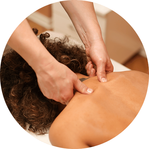 massage therapist giving a deep tissue massage
