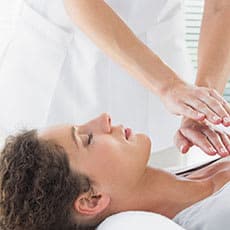 reiki practitioner giving treatment