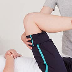 massage therapist giving a sports massage